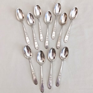 11 early Samuel Kirk & Son coin silver &quot;Mayflower&quot; pattern teaspoons, MEC monogram; 270 grams