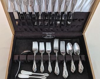 54 piece Wallace sterling &#39;Rose Point&#39; pattern flatware set in fitted case; 1,562 weighable grams