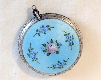 Silver toned mounted mirror compact, guilloche enamel, engine turned back, rouge and powder shaker, floral motif; 2 1/8 W x H x 3/8 D in.