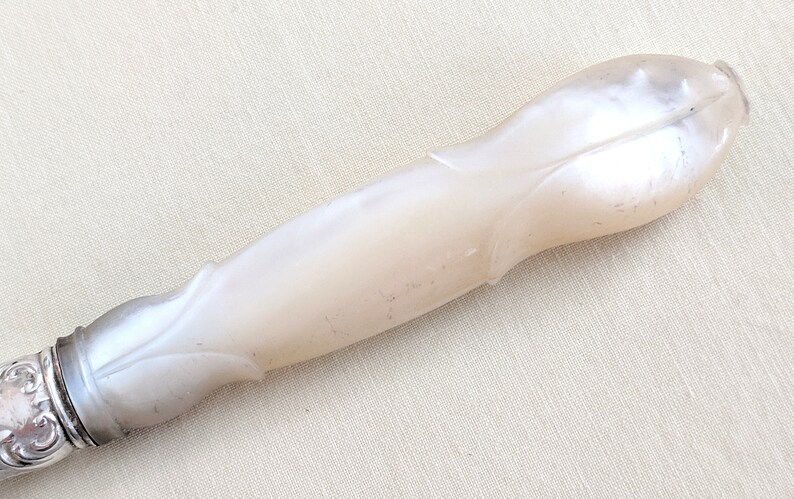Set of 4 Victorian carved pearl handle silver plated knives with sterling collar