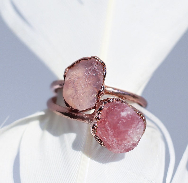 Raw Madagascar rose quartz stone set on a copper ring band with an organic style setting.