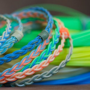 Aiuin Bracelet en silicone /à ornement en acier inoxydable avec sac de bijoux