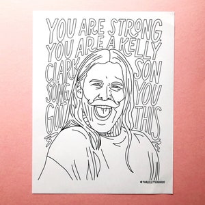 May include: A black and white line drawing of a man with long hair and a mustache. The man is sticking his tongue out and smiling. The text "YOU ARE STRONG. YOU ARE A KELLY CLARKSON SONG. GOT THIS." is written around the man's head.
