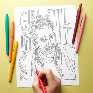 May include: A black and white line drawing of a person with the text "Girl. Still. Got. It." printed above the person's head. The person is smiling and wearing a jacket. A hand is holding a red marker and is coloring in the drawing.