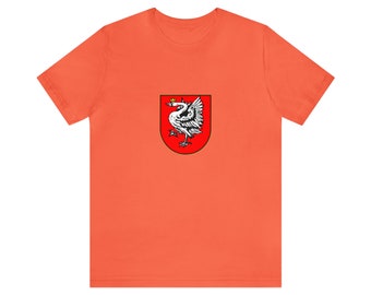 May include: Orange t-shirt featuring a crest with a white swan wearing a crown, set against a red background. The swan is depicted with detailed feathers and a regal pose. The shirt is made of a soft material.