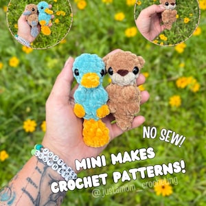 May include: A hand holds two mini crochet animal patterns: a blue and yellow platypus and a brown otter. The image includes text that reads "NO SEW! MINI MAKES CROCHET PATTERNS!"