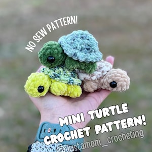 May include: A hand holding four small, crocheted turtle toys in shades of green, yellow, and tan. The turtles have black eyes. Text on the image reads "NO SEW PATTERN!" and "MINI TURTLE CROCHET PATTERN!"
