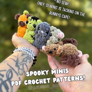 May include: A selection of miniature crochet bunnies in various colours, including orange, green, grey, and brown. The image includes the text "SPOOKY MINIS PDF CROCHET PATTERNS!" and the Instagram handle "@justamom_crocheting."