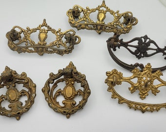Assortment of 6 antique victorian French pull and knob.  Gold ornate decorative pull