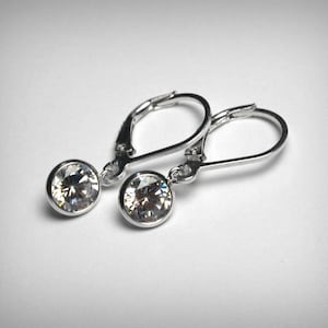 ピアス +ENGBROX+ silver925 flow cubic earring EBEA24018SV C LUXE by Claire's Sterling Silver Cubic Zirconia Hoop & Bow