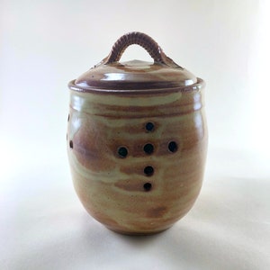 Garlic Jar, with a Cream Breaking Rust Glaze.