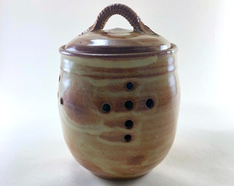 Stoneware Garlic Storage Jar, with a Cream Breaking Rust Glaze.