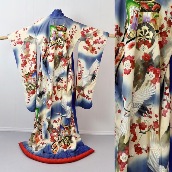 Close-up detail of traditional Japanese kimono embroidery featuring cranes and cherry blossoms, showing intricate metallic thread work symbolizing eternal love and renewal