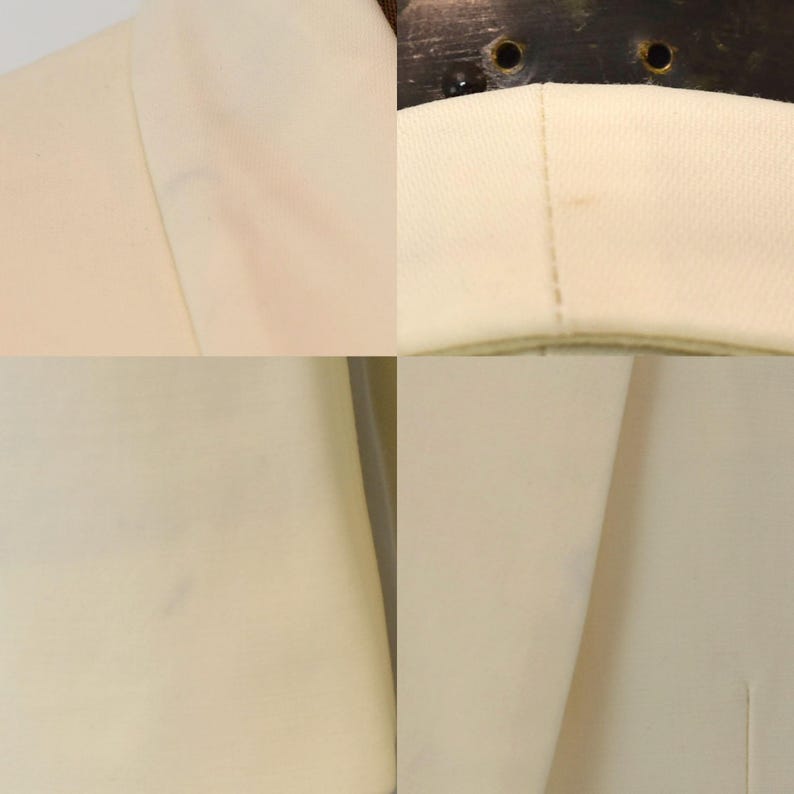 May include: Close-up of a cream-colored blazer. The fabric appears to be a smooth, woven material. The image shows details of the collar, lapel, and seams, highlighting the tailoring and construction of the garment. The blazer is a neutral color, suitable for various outfits.