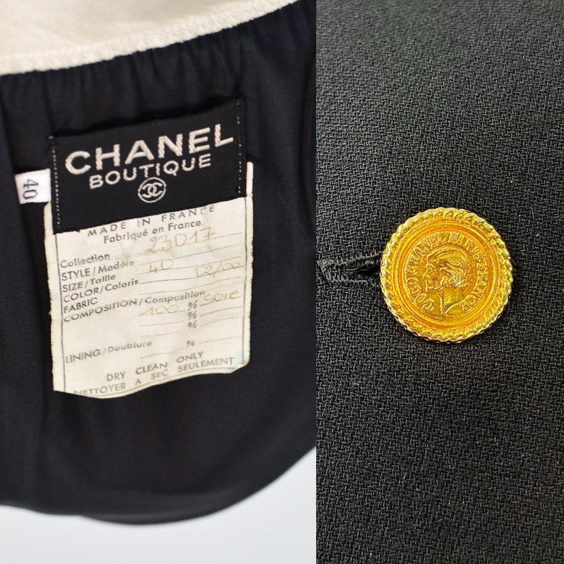 May include: Black blazer with a gold button featuring a profile of a woman. The label reads "CHANEL BOUTIQUE" and includes details about the fabric composition: "MADE IN FRANCE, Fabriqu&eacute; en France, Collection, STYLE/Modaie, SIZE/Tallle, COLOR/Coloris, FABRIC, COMPOSITION/Composition, 100% Soie, LINING/Doublure, DRY CLEAN ONLY, NETTOYER A SEC SEULEMENT".