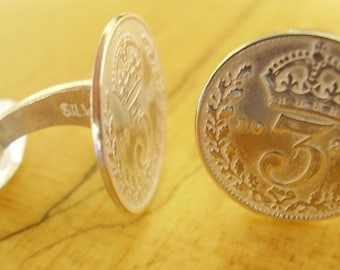 Un par de gemelos de plata de ley con moneda Thrupenny Bit de 1926