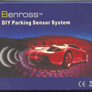 May include: A red car with a parking sensor system. The box features the text "Benross™ DIY Parking Sensor System" and the CE and TÜV ISO 9001 logos.