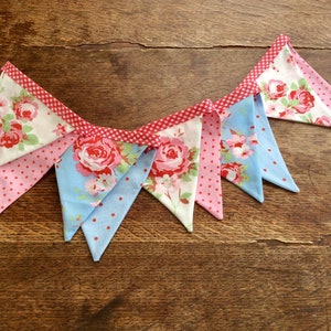 Afternoon Tea Floral Garden Party,Red and blue vintage roses and spotty fabrics hanging, garden party, Wedding Garland on red Gingham tape.