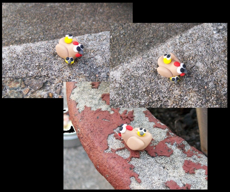 May include: Three small, brown clay figurines of turkeys with yellow, red, and black details. The turkeys are sitting on a gray, textured surface.