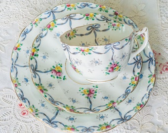 Antique English bone china tea trio with hand decorated ribbon bows and swags