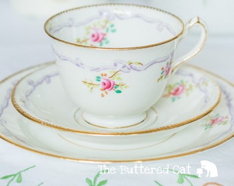 Antique Court China English tea trio, hand-decorated ribbons and roses