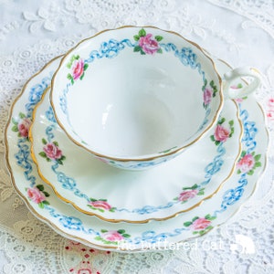 Antique Crescent China English tea trio, blue ribbon bow and pink rose border
