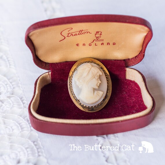 Vintage carved shell cameo brooch / pin of a young woman's head bust, gold-plated frame
