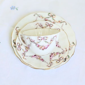 Antique Aynsley bone china tea trio, hand-decorated ribbon bows, swags, slight crazing