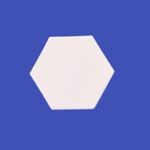 May include: White hexagonal ceramic tile with a smooth surface.