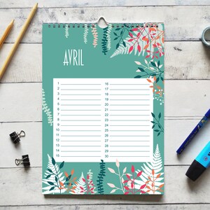 May include: A wall calendar page for the month of April featuring a teal background with white and orange botanical illustrations of ferns and leaves. The center contains a white rectangular grid with lines numbered 1 through 30 for planning.