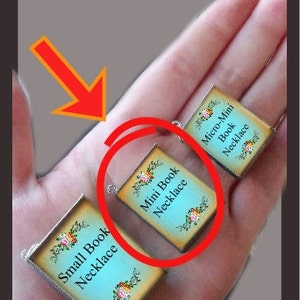 May include: Three miniature book necklaces, each with a different size. The smallest necklace is labeled "Micro-Mini Book Necklace", the middle necklace is labeled "Mini Book Necklace", and the largest necklace is labeled "Small Book Necklace".