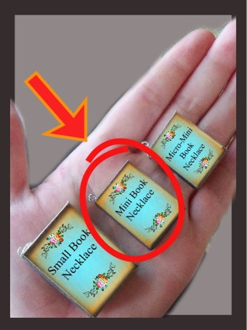 May include: Three miniature book necklaces, each with a different size. The smallest necklace is labeled "Micro-Mini Book Necklace", the middle necklace is labeled "Mini Book Necklace", and the largest necklace is labeled "Small Book Necklace".