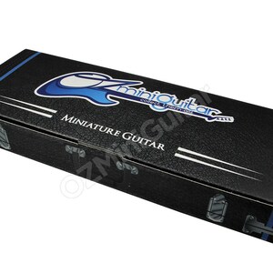 May include: Black textured box with the words "miniGuitar" and "Miniature Guitar" in white and blue. The box has a blue stripe and white lines. The box has silver metal clasps.
