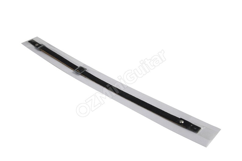 May include: A black guitar strap with a silver buckle and rivets, packaged in a clear plastic sleeve. The strap is made of a thin, durable material and is designed to be worn over the shoulder.