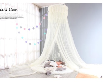May include: A cream-coloured canopy bed net with a decorative top, suspended from the ceiling. The net drapes down to the floor, creating a soft, flowing effect. The text "Special Item" is visible in the upper left corner.