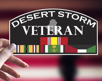 May include: Black and white sticker with the text "Desert Storm Veteran" and a map of Iraq. The sticker has a row of military ribbons with flags from the United States, Kuwait, Saudi Arabia, and the United Arab Emirates.