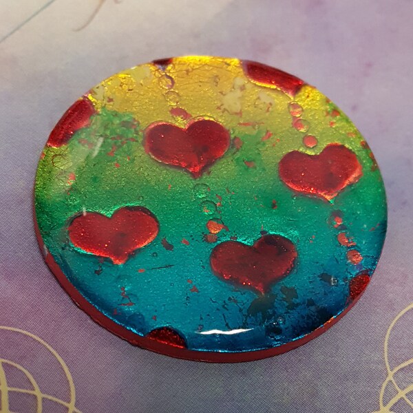 hearts on rainbow foiled polymer clay round pendant