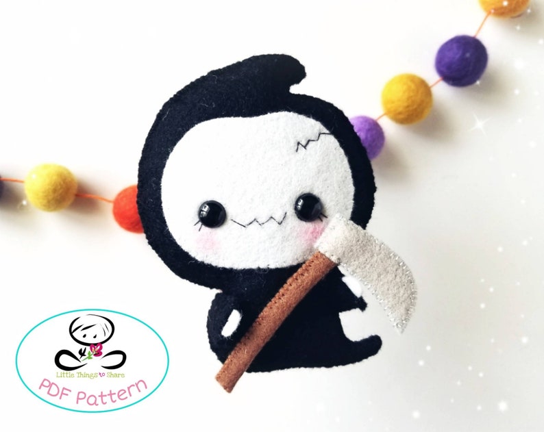 May include: A black and white felt plush toy of the Grim Reaper with a brown scythe. The toy has a cute, cartoonish face with big eyes and a stitched-on smile. The toy is holding the scythe in its right hand.