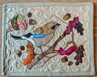 Finished Textile Art mounted 8 by 6" autumn jay quilt with raw applique and patchwork