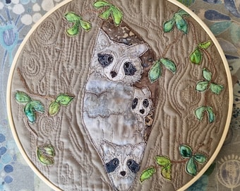 Finished Textile Art mounted I0" hoop racoon family on mushroom cotton