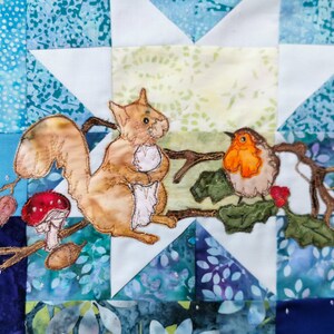 May include: A brown squirrel with a bushy tail sits on a branch with a red robin. The squirrel is holding a nut in its paws. The branch is decorated with green leaves and a red mushroom.