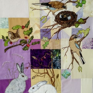 May include: A quilted wall hanging featuring a variety of birds, including a wren, a jay, and a pair of jays in a nest. The birds are embroidered in shades of brown, blue, and white. The background is a patchwork of purple, beige, and white fabric.