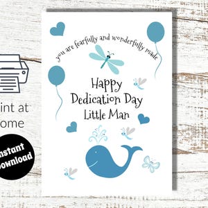 May include: A white card with blue illustrations and text. The card features a blue whale, balloons, hearts, and dragonflies. Text includes "Happy Dedication Day Little Man" and "you are fearfully and wonderfully made". The words "print at home" and "Instant Download" are also visible.