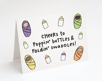 Cheers To Poppin' Bottles & Foldin' Swaddles! Greeting Card. New Baby Card. Baby Swaddle. Baby Bottles. Baby Gift. Unisex Baby Card. Babies.