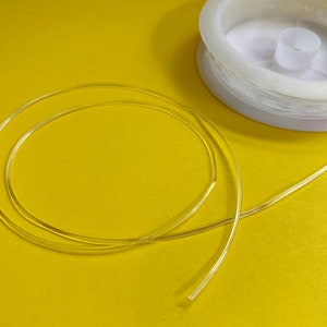 Clear Elastic Stretch Cord for bracelets, jewelry making, friendship bracelets. 1mm round clear elastic cord, 1 roll, 4 yards