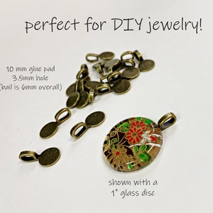 May include: A close-up of gold-toned metal bails for jewellery making. The bails are 10 mm in diameter with a 3.5 mm hole. The text "perfect for DIY jewellery!" is visible at the top of the image. The text "10 mm glue pad 3.5mm hole (bail is 6mm overall)" is visible at the left of the image. The text "shown with a 1" glass disc" is visible at the bottom of the image.