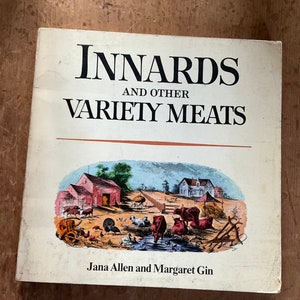 May include: A book titled "Innards and Other Variety Meats" with a colorful illustration of a farm scene on the cover. The book is by Jana Allen and Margaret Gin.