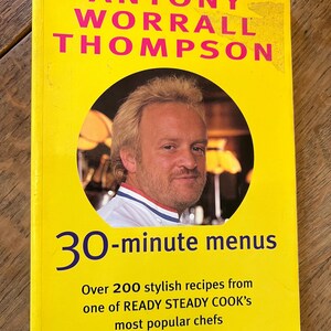May include: A yellow book cover with the title "ANTONY WORRALL THOMPSON 30-minute menus" and the text "Over 200 stylish recipes from one of READY STEADY COOK'S most popular chefs". A photo of the chef is featured on the cover.