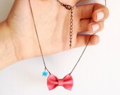 Necklace with a little bow of iridescent coral pink leather,  little enamelled sky-blue star