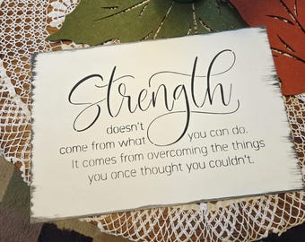 Strength doesn't come from what you can do it comes from oversoming the thing you once thought you couldnt,strength motivational wood sign